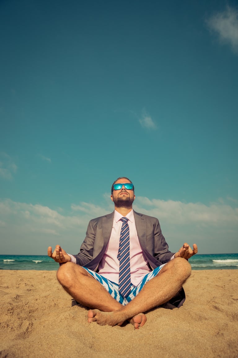 Funny businessman on the beach